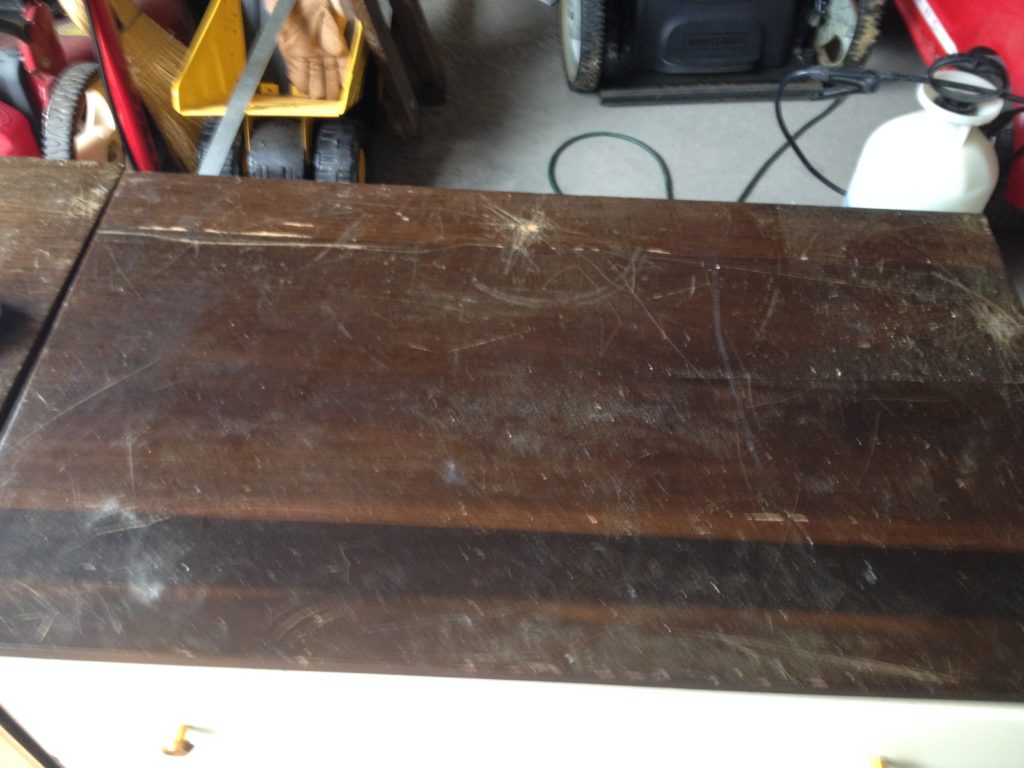 Old scratched nightstand in need of a restoration