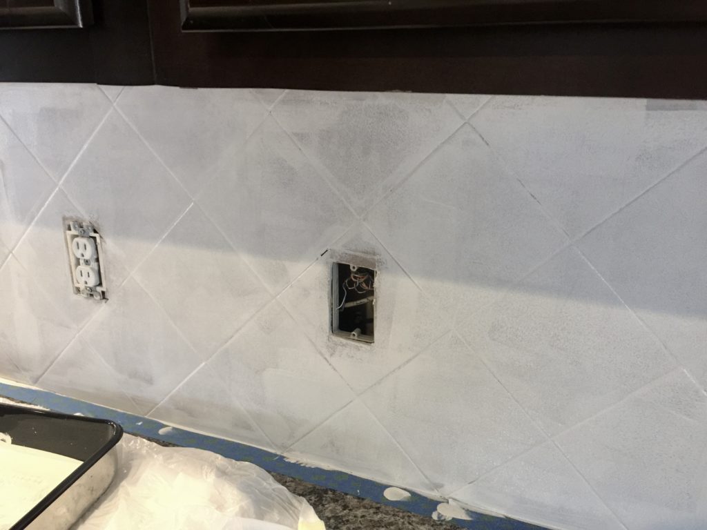 Process of painting tiled kitchen backsplash
