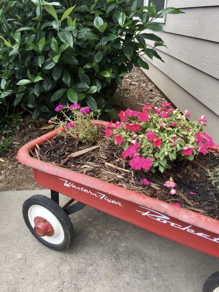 DIY Farmhouse style planter from a rusty red wagon
