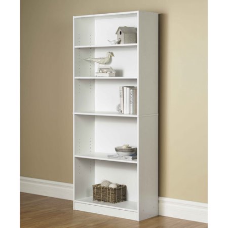 A tall white shelve with sparse decor.