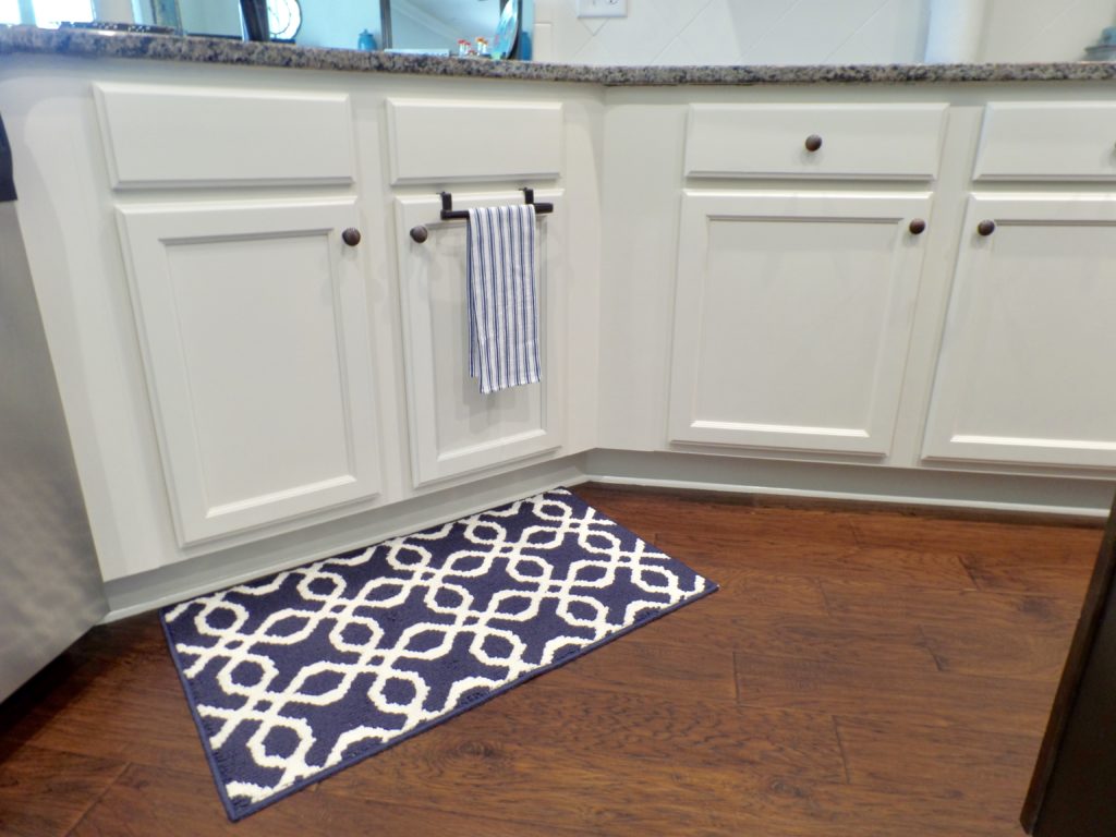 Painted white bottom cabinets after a kitchen makeover.