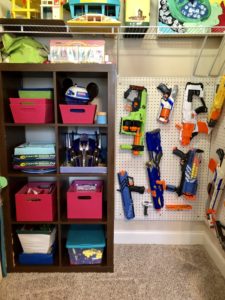 diy nerf gun wall in a storage area