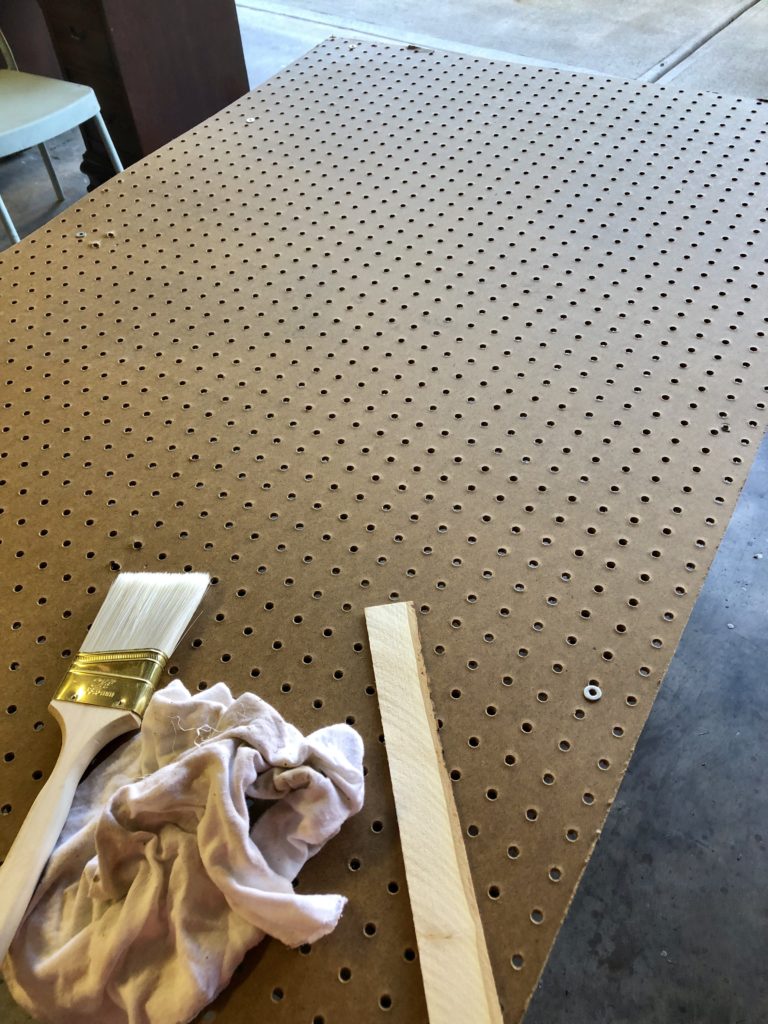 Pegboard and supplies to make a nerf gun holder wall