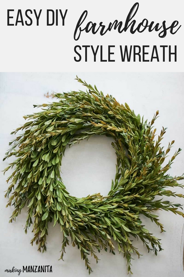 Pinterest graphic with text that reads \"Easy DIY Farmhouse Style Wreath\" and a wreath made from greenery on a white background.