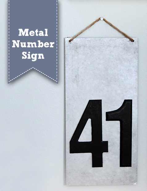 A metal sign with the number \"41\" in black stickers.