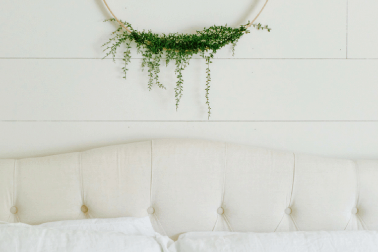 DIY Hoop wreath hanging above bed