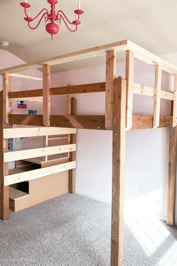 A homemade wooden loft bed without the mattress and before paint.