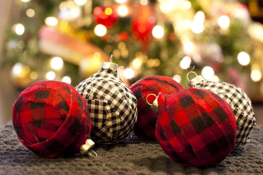 Round ornaments covered in black, white, and red checkered cloth.