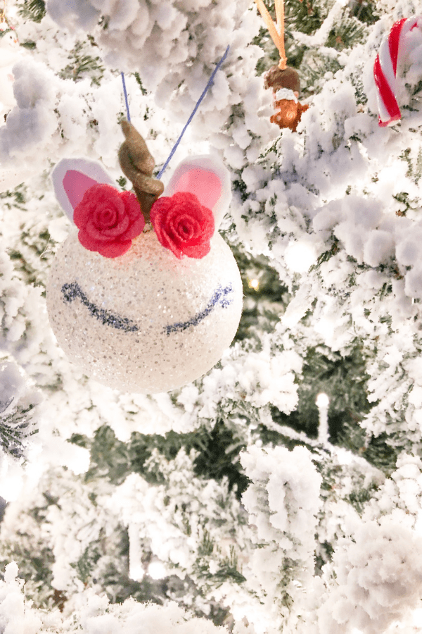 a homemade unicorn ornament made from a Styrofoam ball and other craft supplies. 