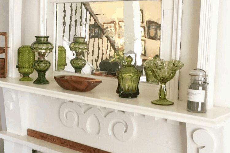 Green glass pieces on a mantel