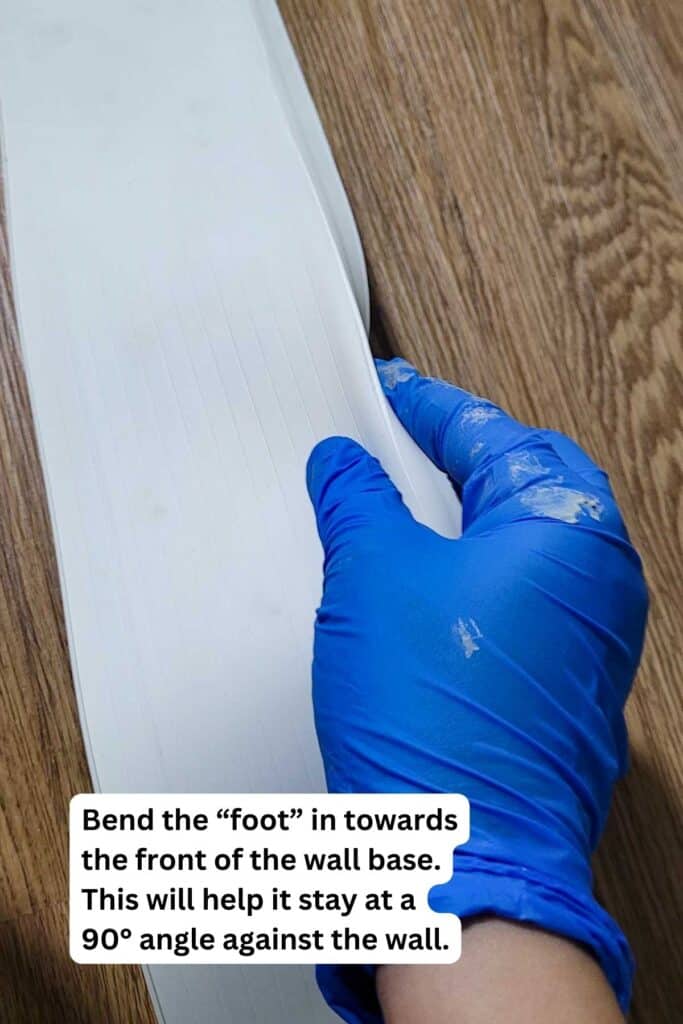 Folding vinyl wall base to create a bottom \"foot.\"