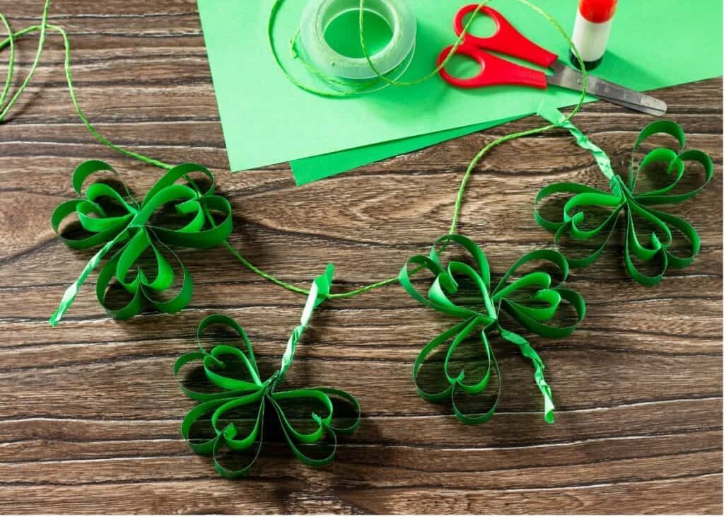 A St. Patrick's Day shamrock garland made from paper.
