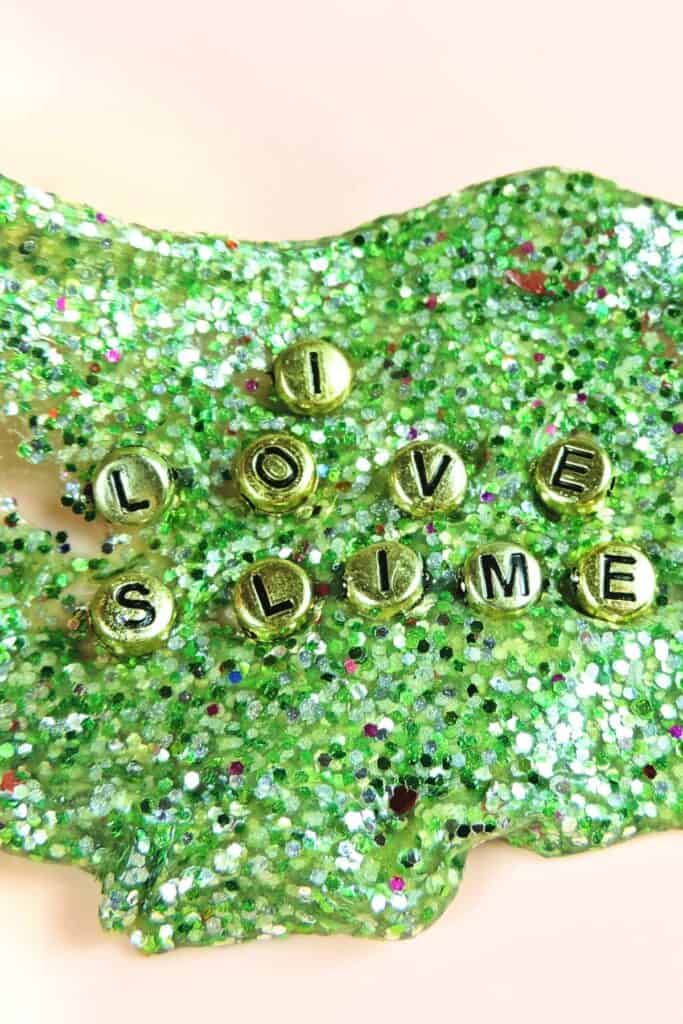 Green slime with gold glitter and beads.